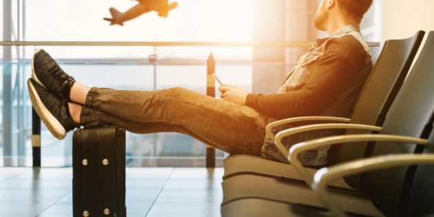 A student waiting to board a plane to his study abroad destination